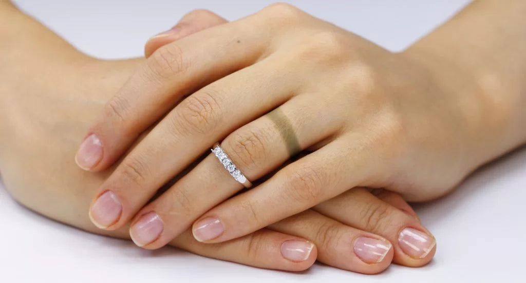 Finger tarnished by ring.