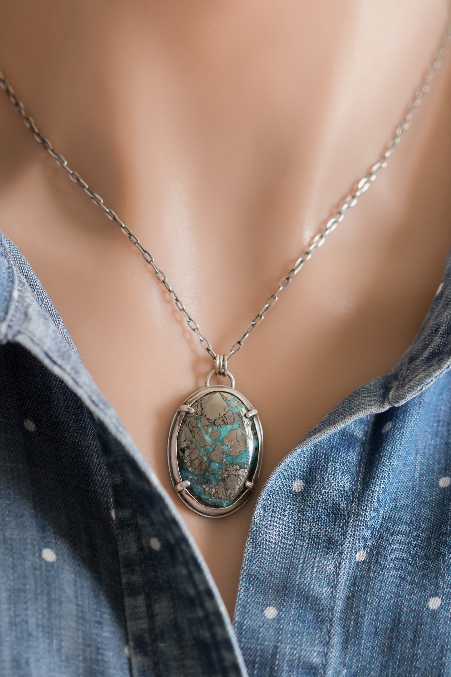 Morenci II turquoise necklace worn on a model with denim shirt, showing pendant size