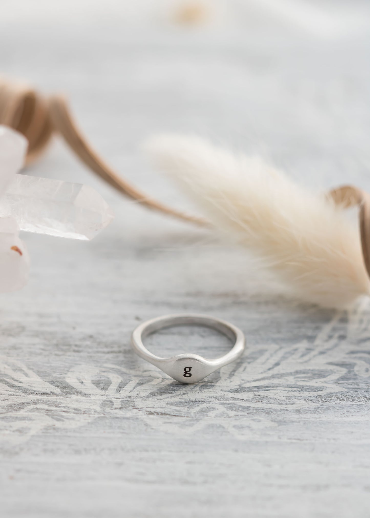 Sterling silver signet ring with a choice of an initial, cross , heart, or paw print.