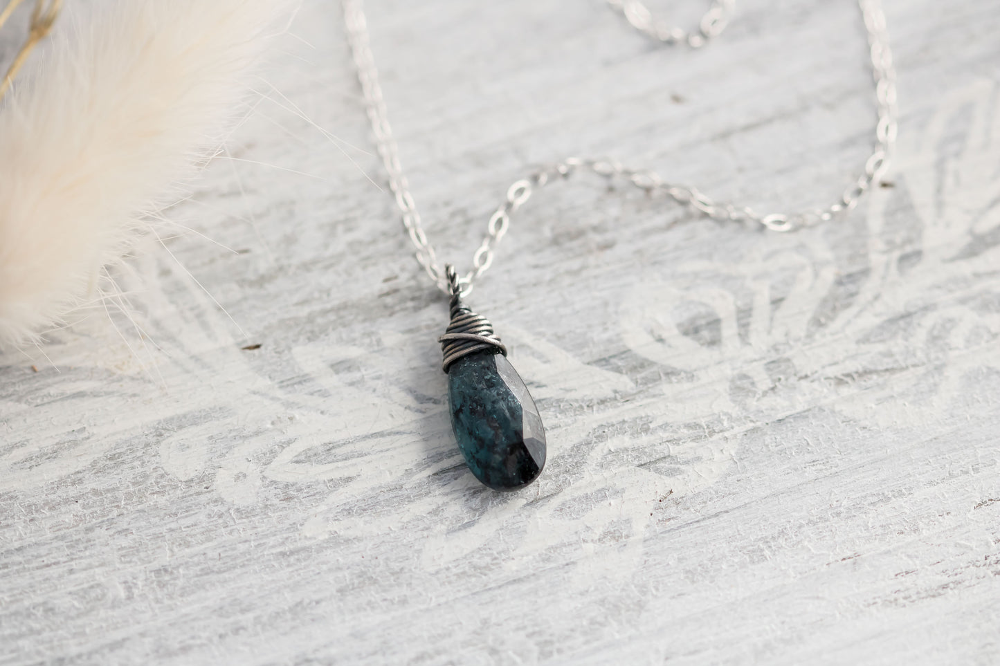 Sterling silver wire wrapped teal moss kyanite briolette gemstone hanging from sterling silver chain.
