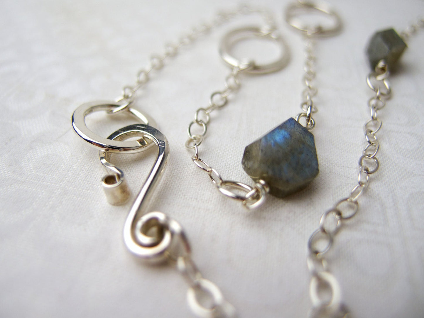 Long 35 inch sterling silver and labradorite necklace with hand made silver circle links and faceted labradorite nuggets.