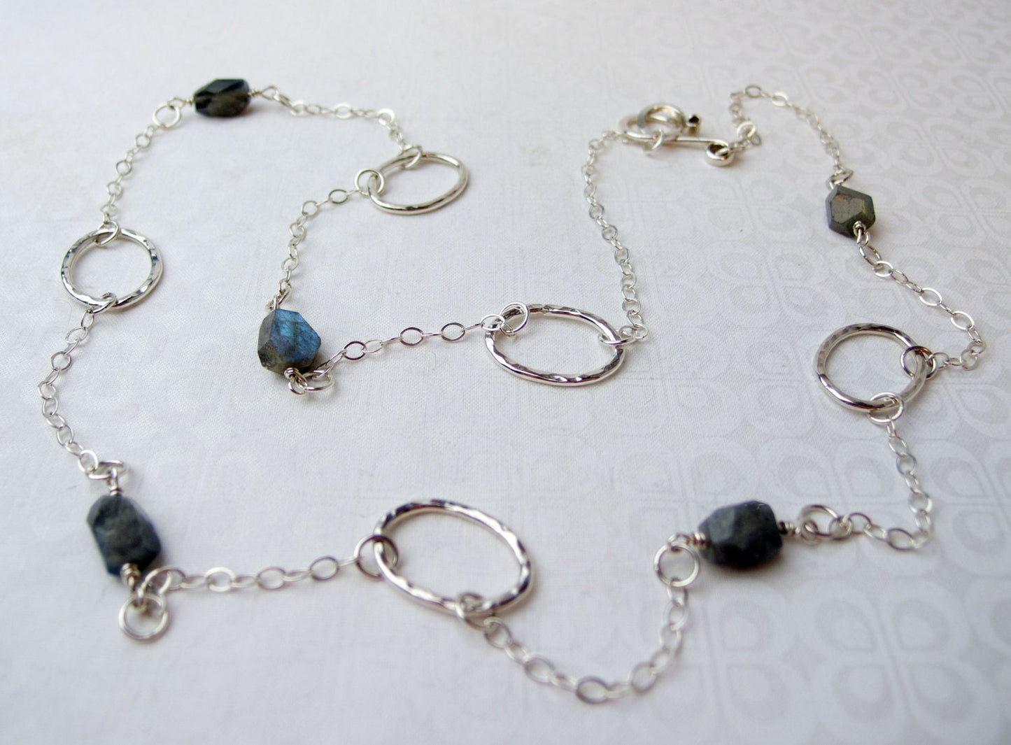 Long 35 inch sterling silver and labradorite necklace with hand made silver circle links and faceted labradorite nuggets.