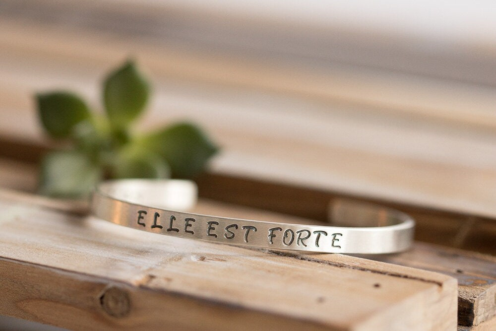 Sterling silver cuff bracelet stamped with Elle Est Forte and Prov 31:25.