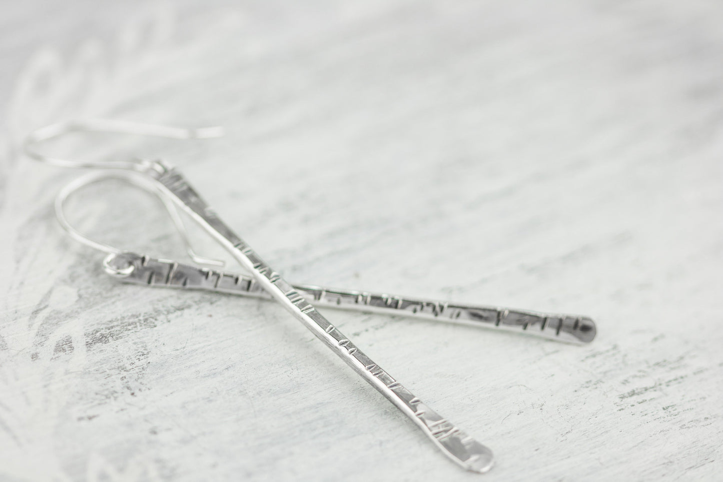 Sterling silver twig earrings2.75" long with hammered birchbark texture.