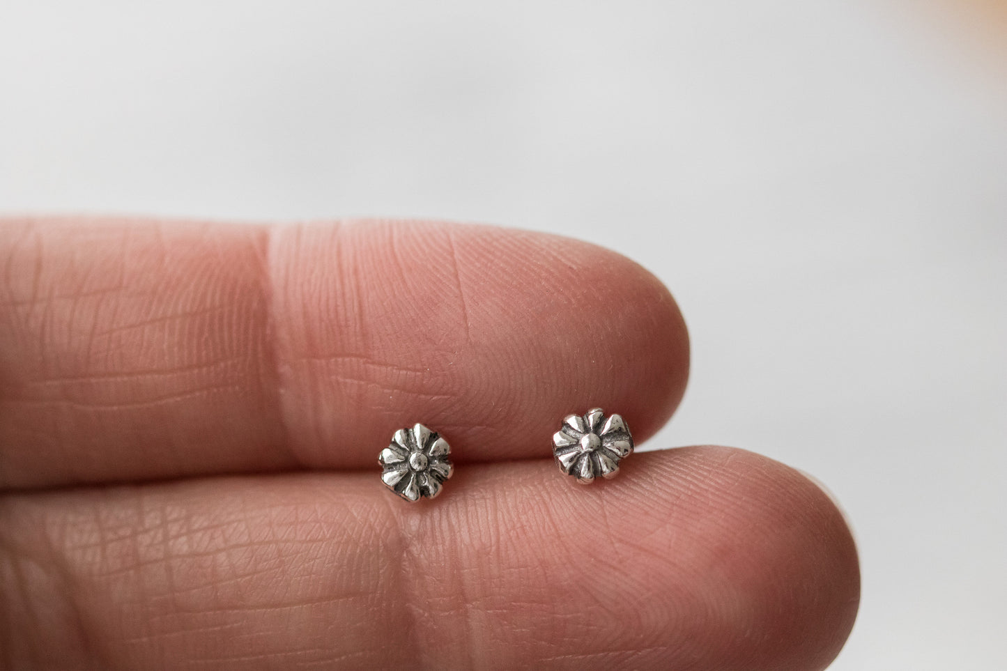 Sterling silver stud earrings.