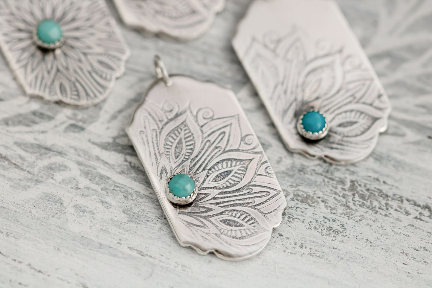 Sterling silver tag necklace with mandala design and a genuine turquoise cabochon.