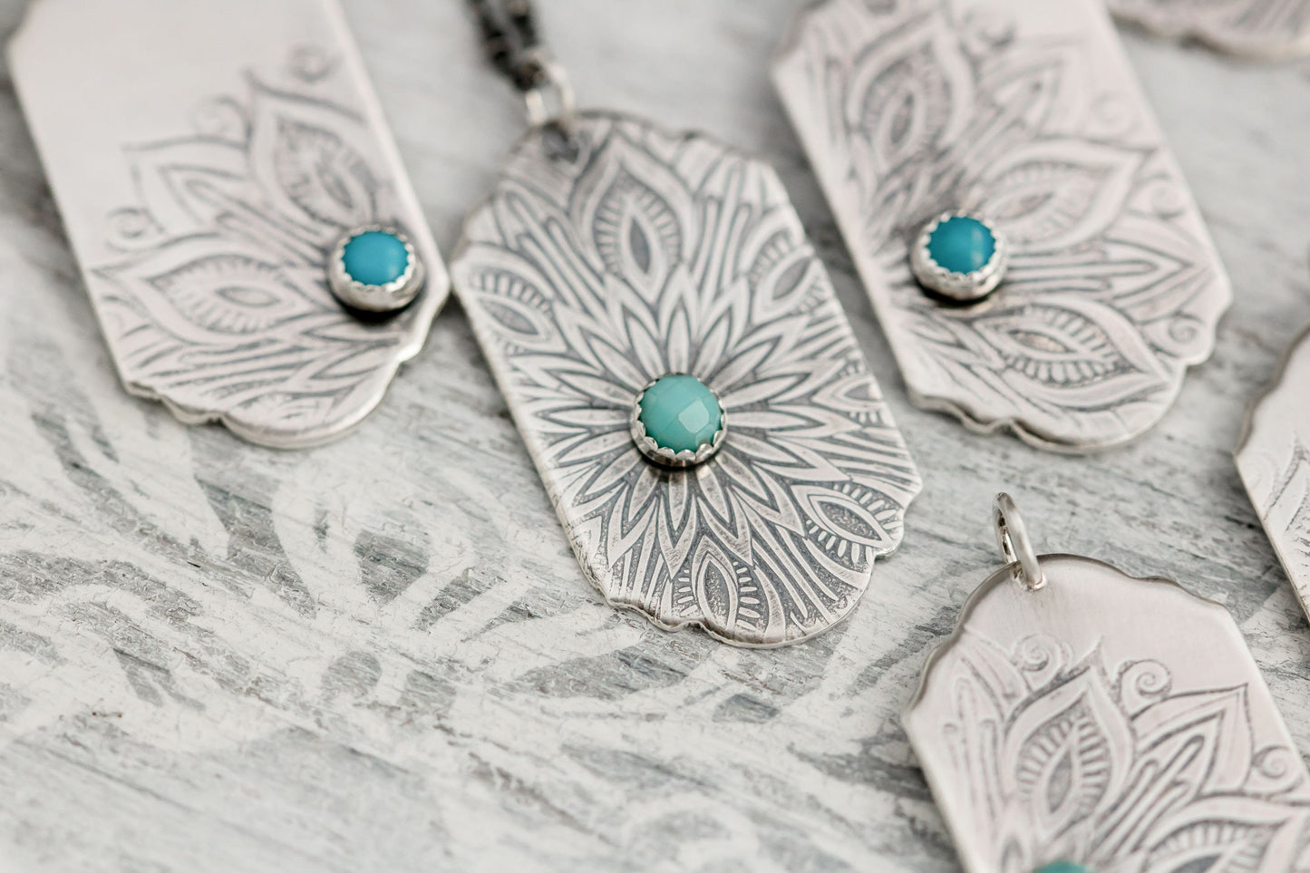 Sterling silver tag necklace with mandala design and a genuine turquoise cabochon.