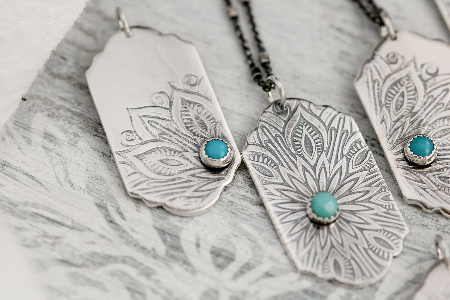 Sterling silver tag necklace with mandala design and a genuine turquoise cabochon.