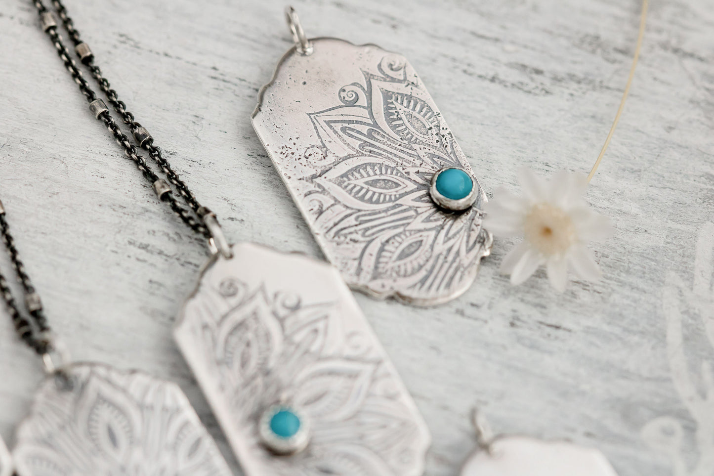 Sterling silver tag necklace with mandala design and a genuine turquoise cabochon.