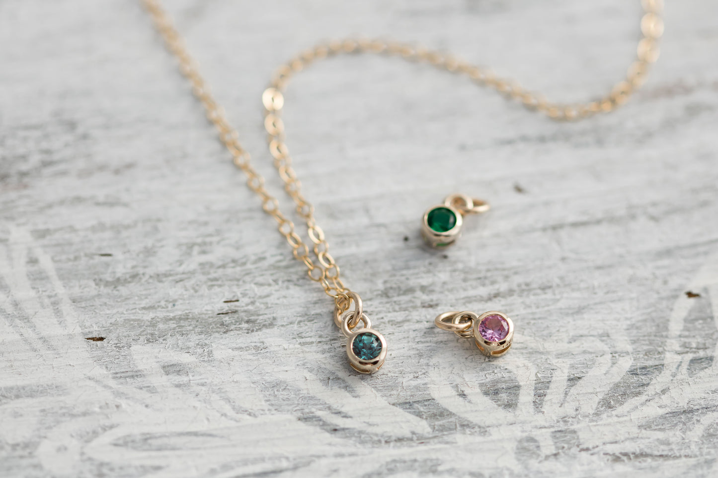 Solid yellow 14k Gold birthstone charms on solid yellow gold  chain.