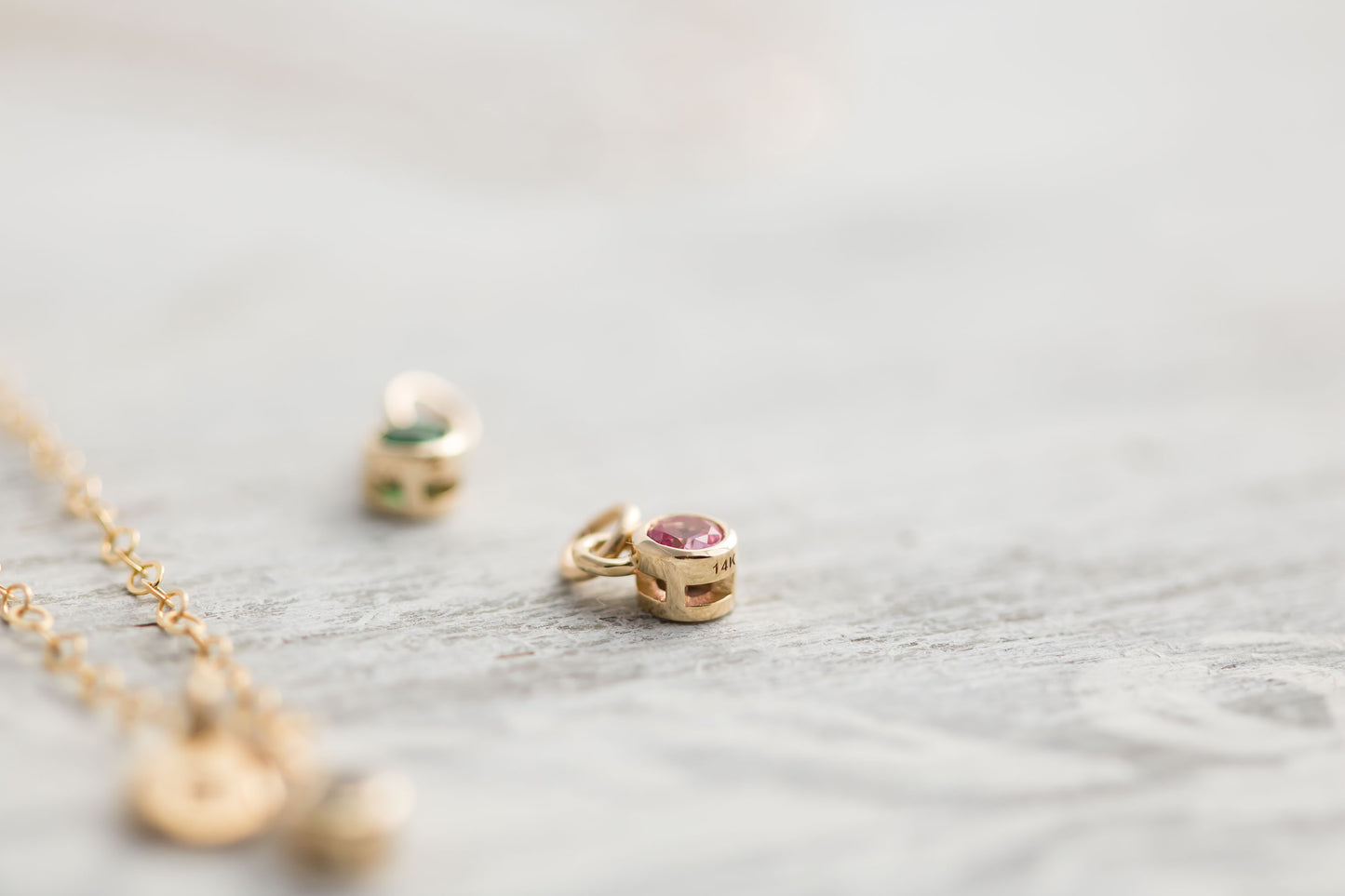 Solid yellow 14k Gold birthstone charms on solid yellow gold  chain.