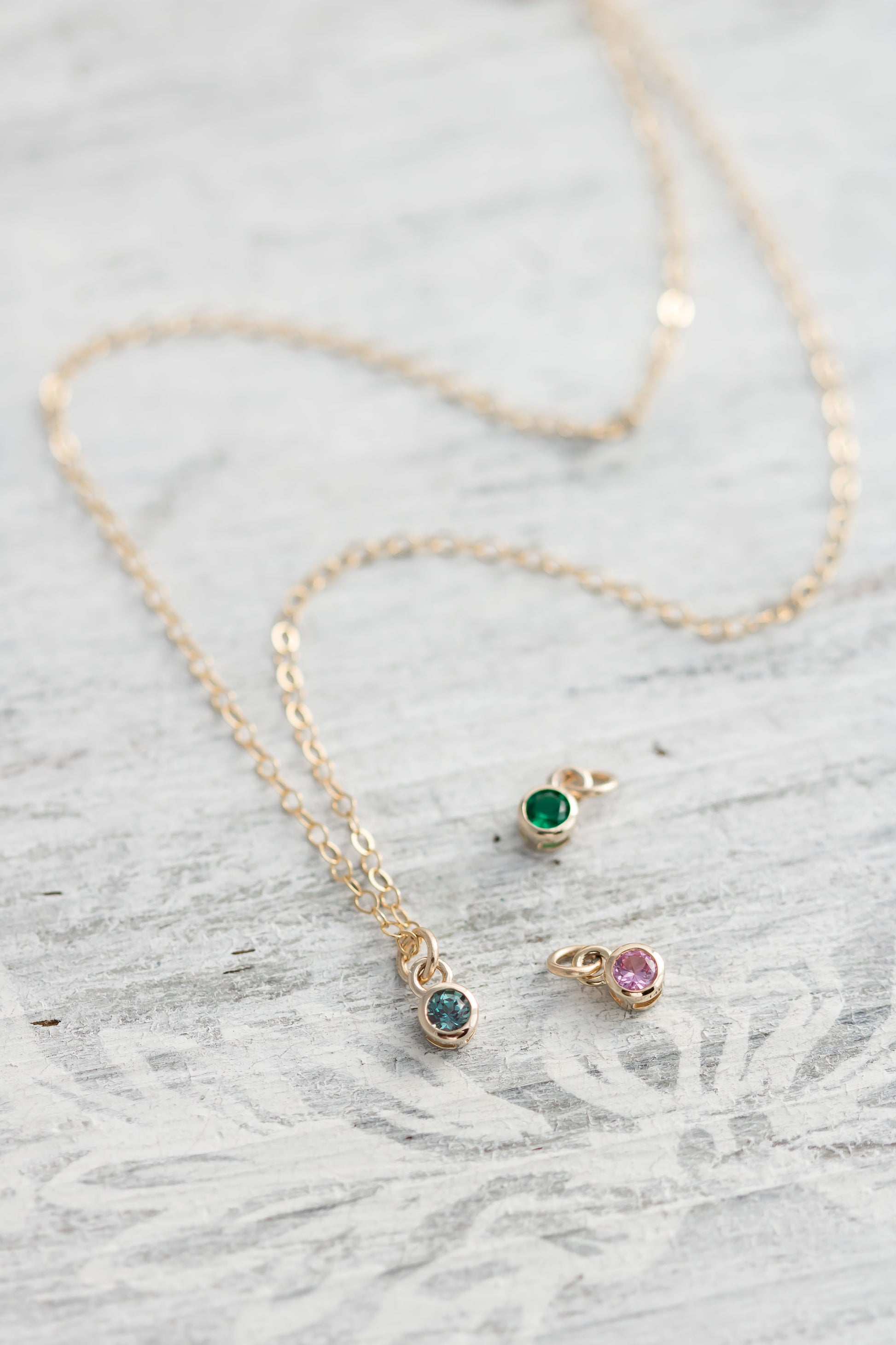Solid yellow 14k Gold birthstone charms on solid yellow gold  chain.