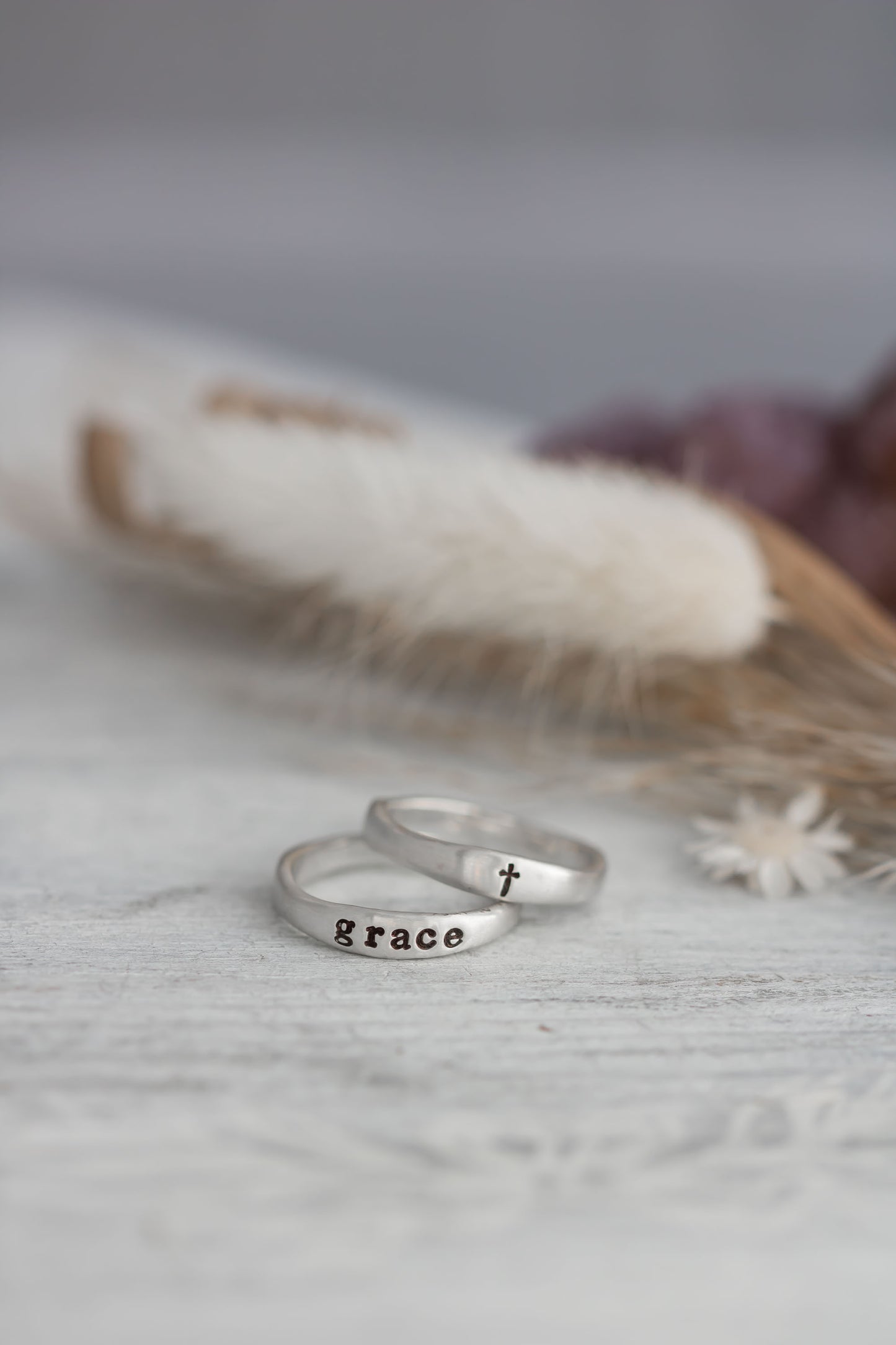 Sterling silver organic free for shape ring set with on ring stamped with the word grace and one with a cross. 
