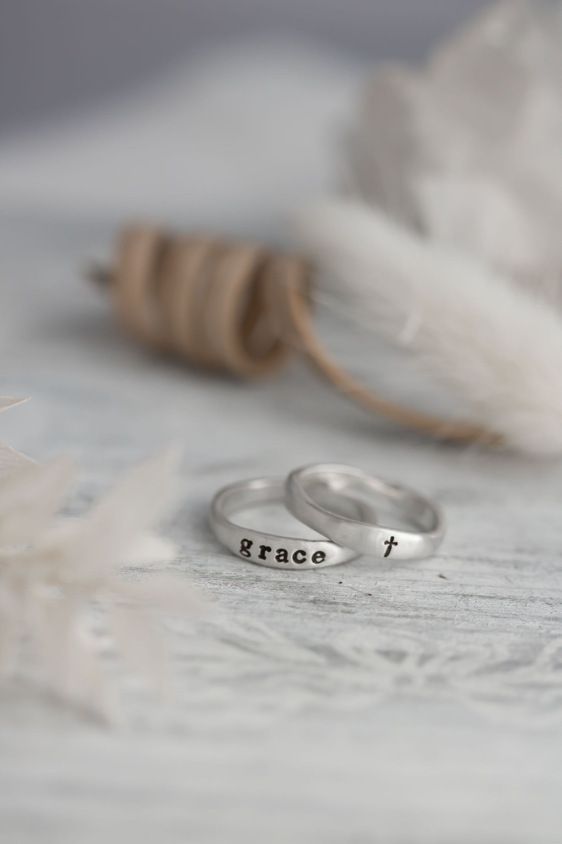 Sterling silver organic free for shape ring set with on ring stamped with the word grace and one with a cross. 