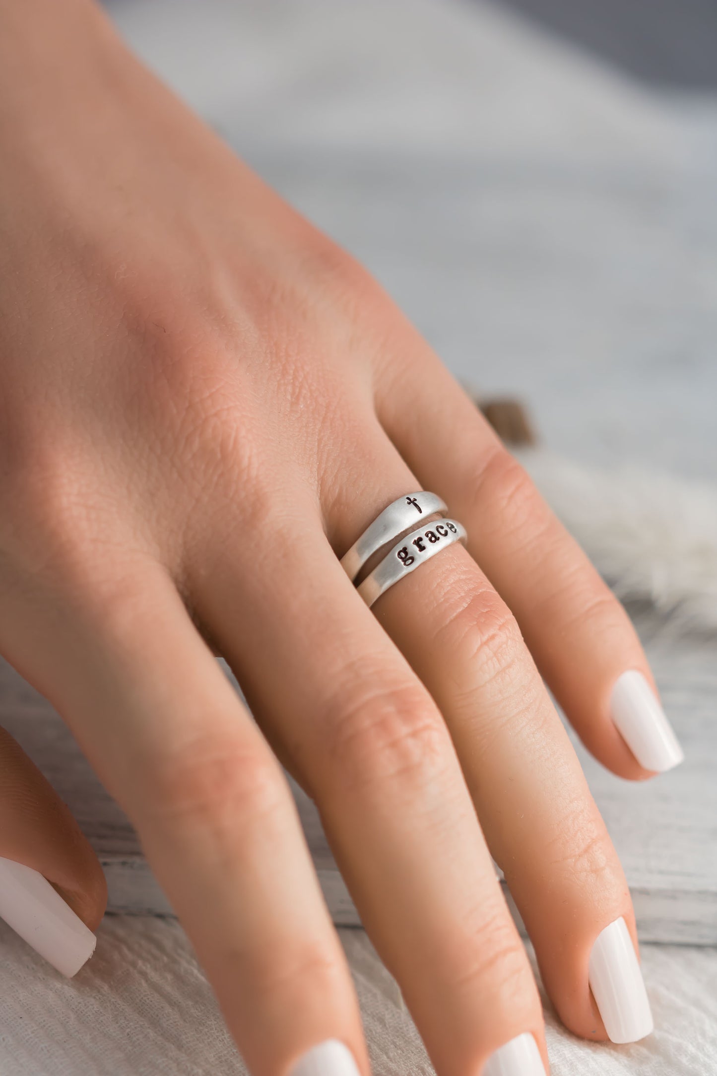 Sterling silver organic free for shape ring set with on ring stamped with the word grace and one with a cross. 
