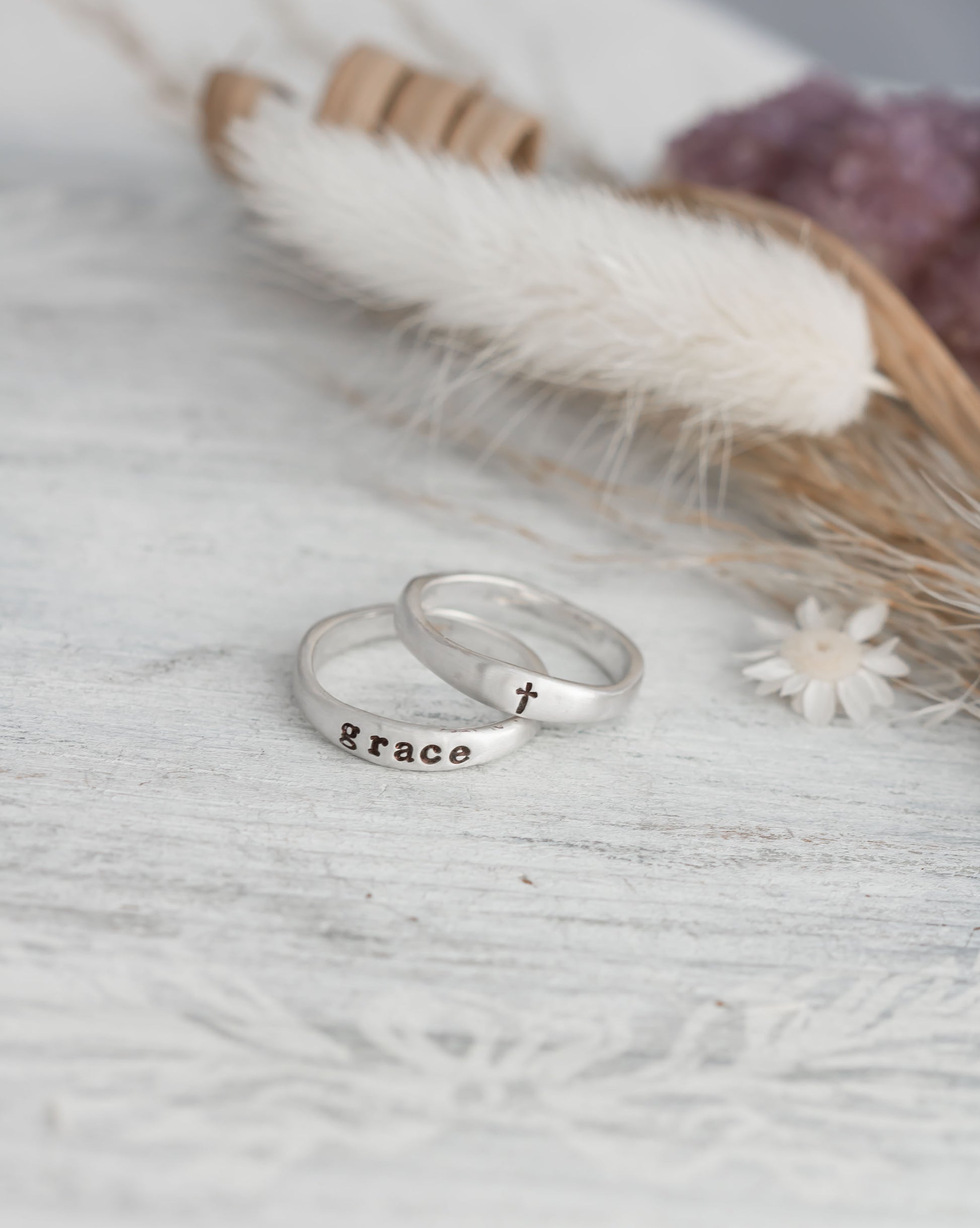 Sterling silver organic free for shape ring set with on ring stamped with the word grace and one with a cross. 
