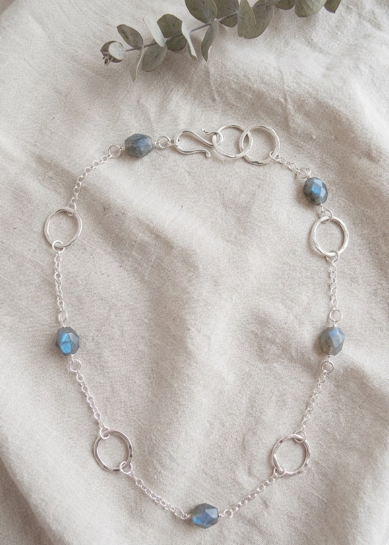 Long 35 inch sterling silver and labradorite necklace with hand made silver circle links and faceted labradorite nuggets.