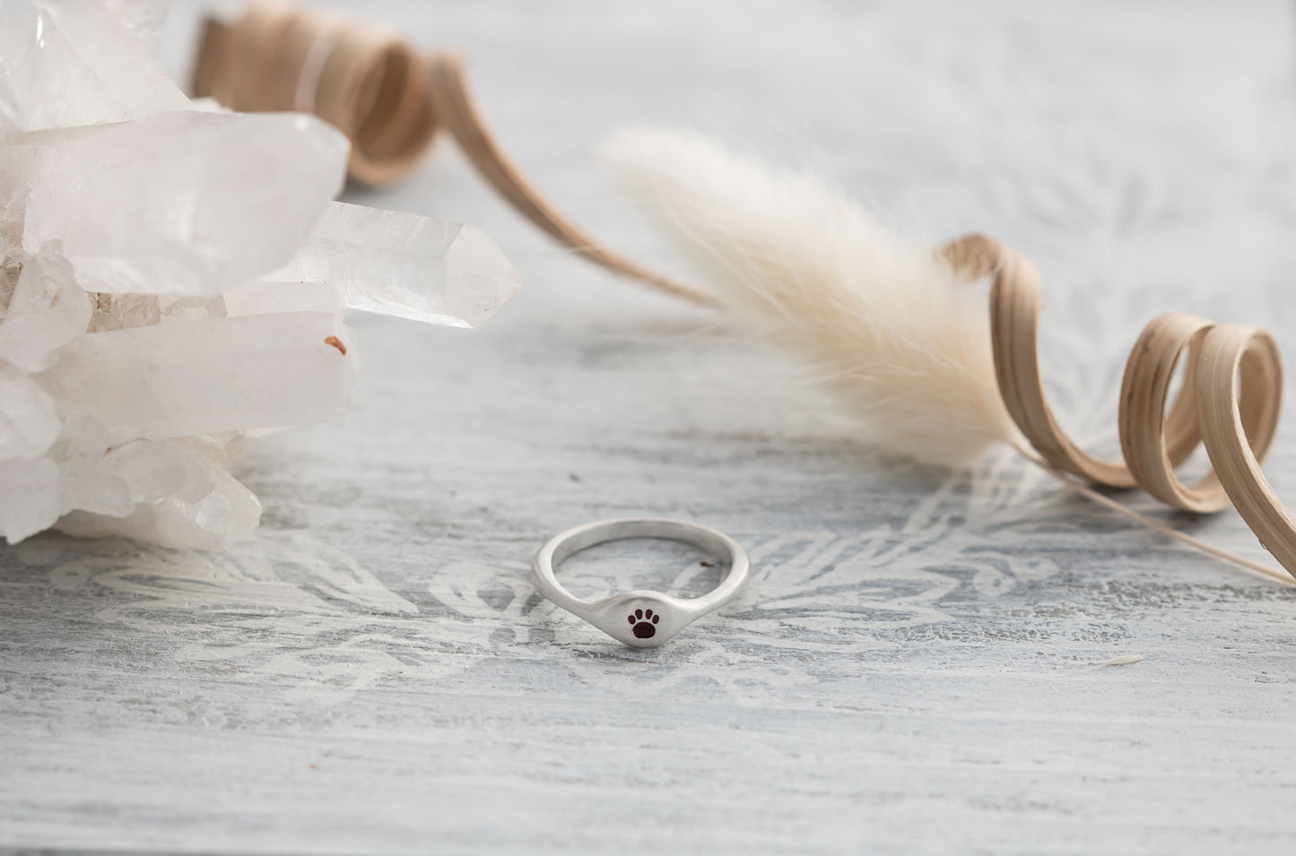 Sterling silver signet ring with a choice of an initial, cross , heart, or paw print. 