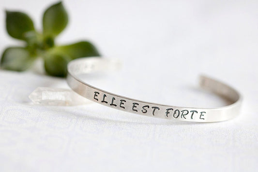 Sterling silver cuff bracelet stamped with Elle Est Forte and Prov 31:25.