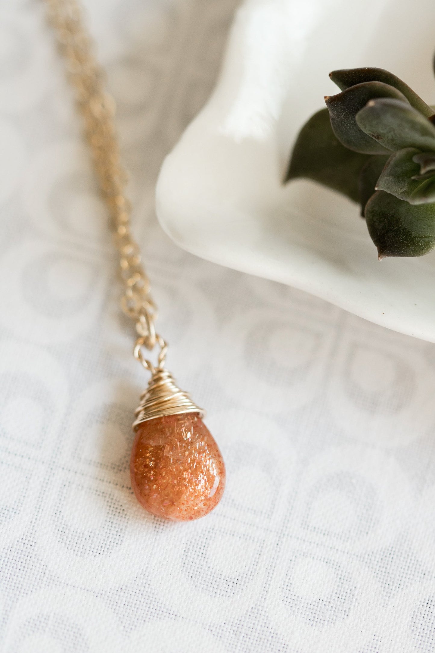 Sunstone pear-shaped briolette wire wrapped in 14 karat gold filled wire necklace on a gold filled chain