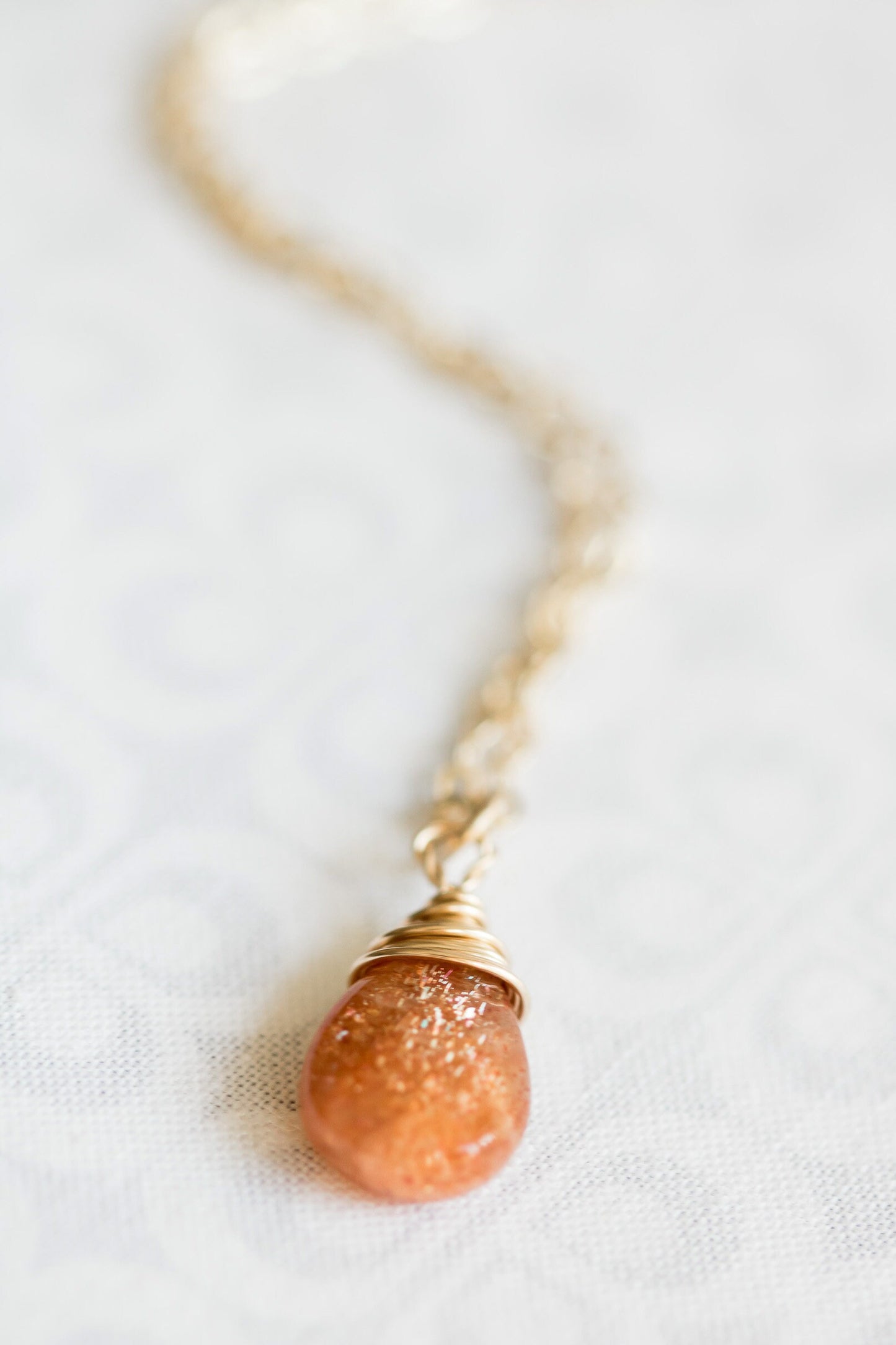 Sunstone pear-shaped briolette wire wrapped in 14 karat gold filled wire necklace on a gold filled chain