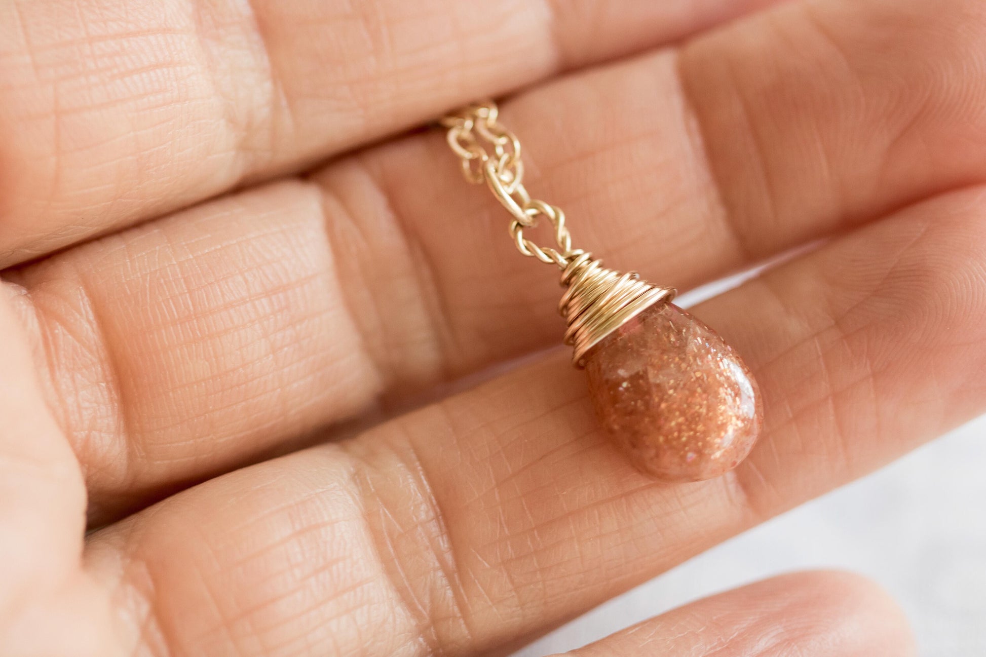 Sunstone pear-shaped briolette wire wrapped in 14 karat gold filled wire necklace on a gold filled chain