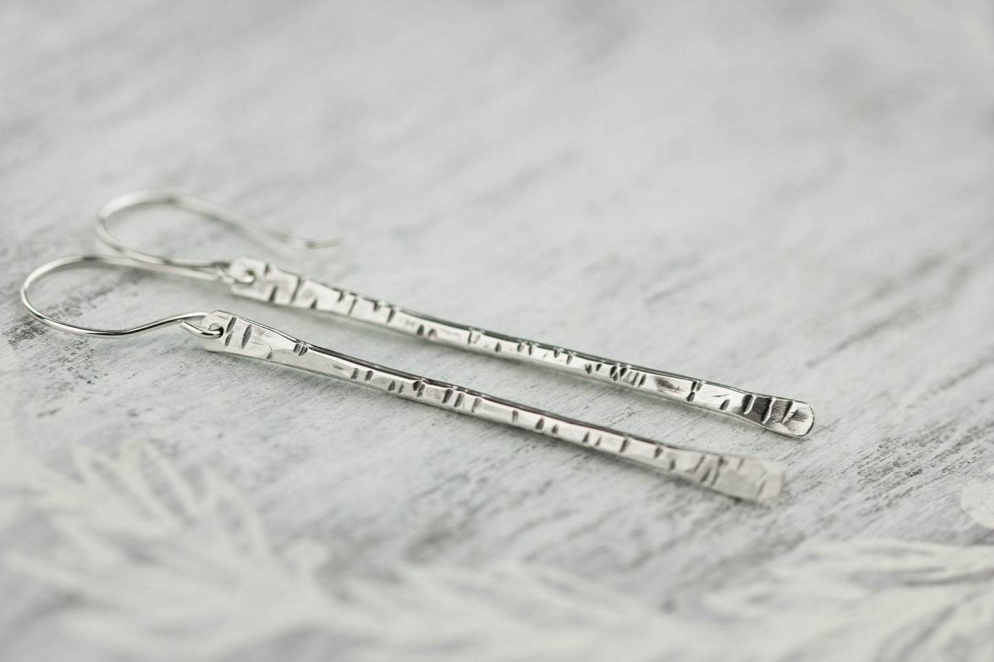 Sterling silver twig earrings2.75" long with hammered birchbark texture.