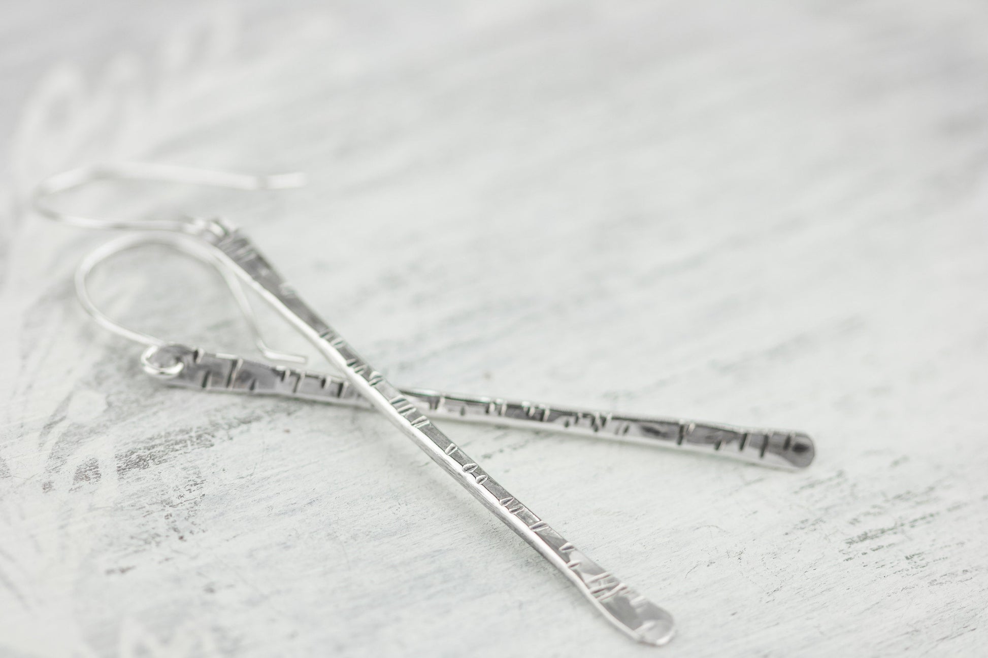 Sterling silver twig earrings2.75" long with hammered birchbark texture.