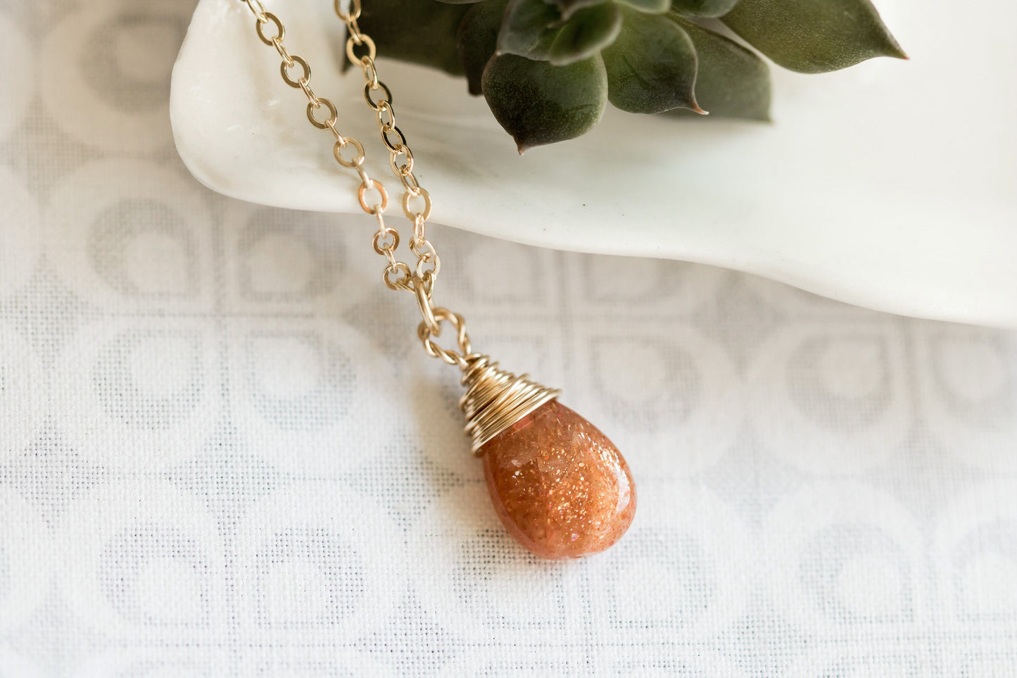 Sunstone pear-shaped briolette wire wrapped in 14 karat gold filled wire necklace on a gold filled chain