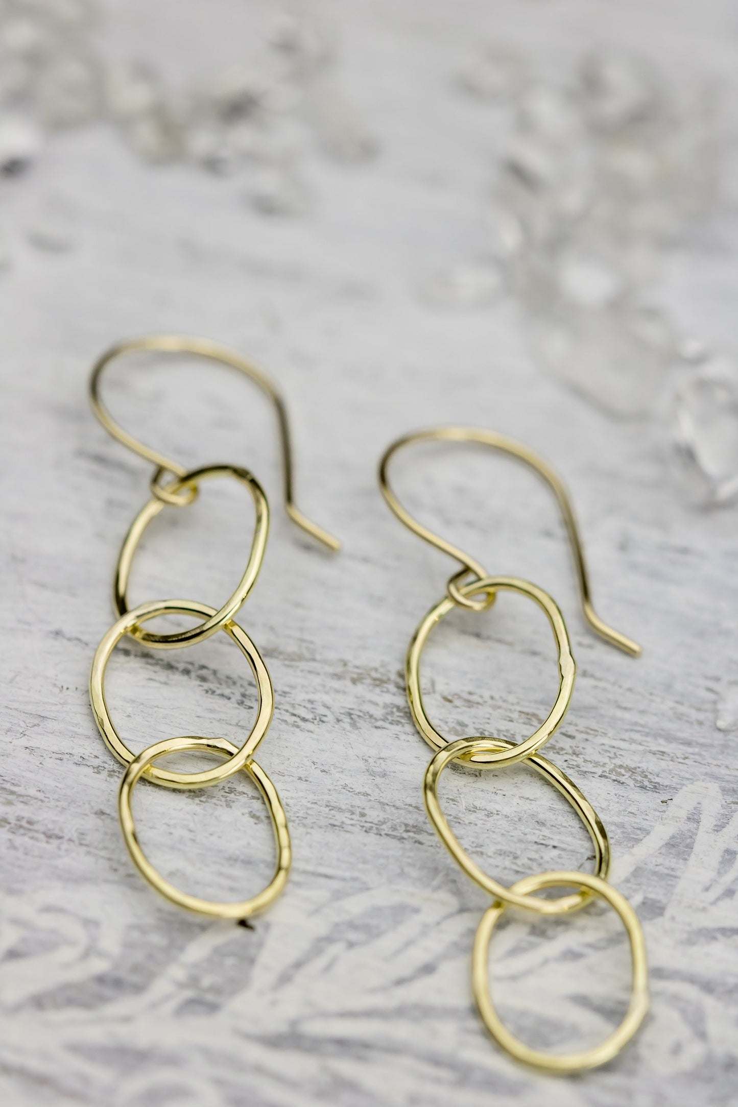 Solid 18k gold triple hoop hook earrings.