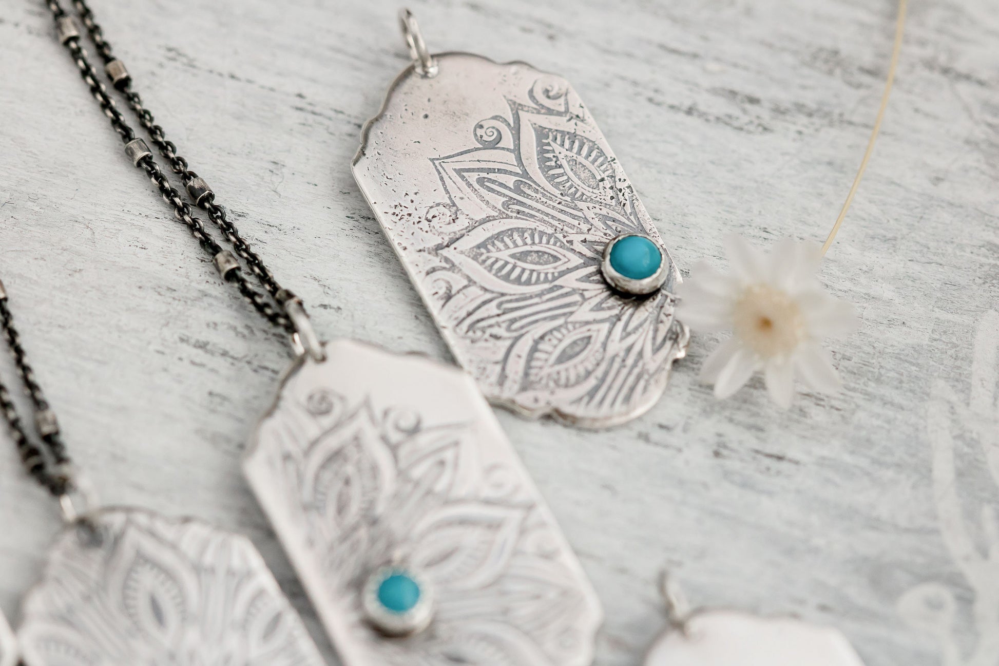 Sterling silver tag necklace with mandala design and a genuine turquoise cabochon. 