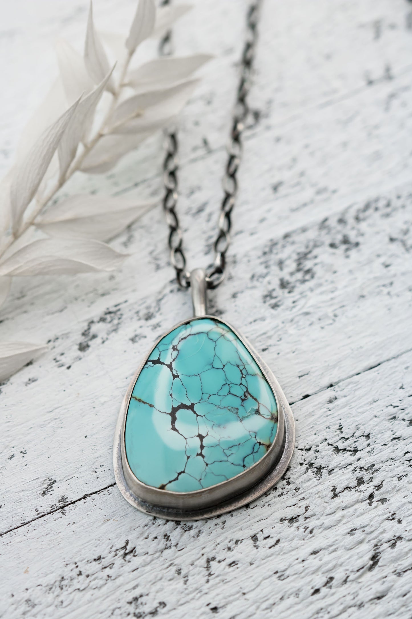 Large Sterling Silver and Genuine Hubei Turquoise with Spiderweb Matrix Necklace on a sterling silver oval chain.