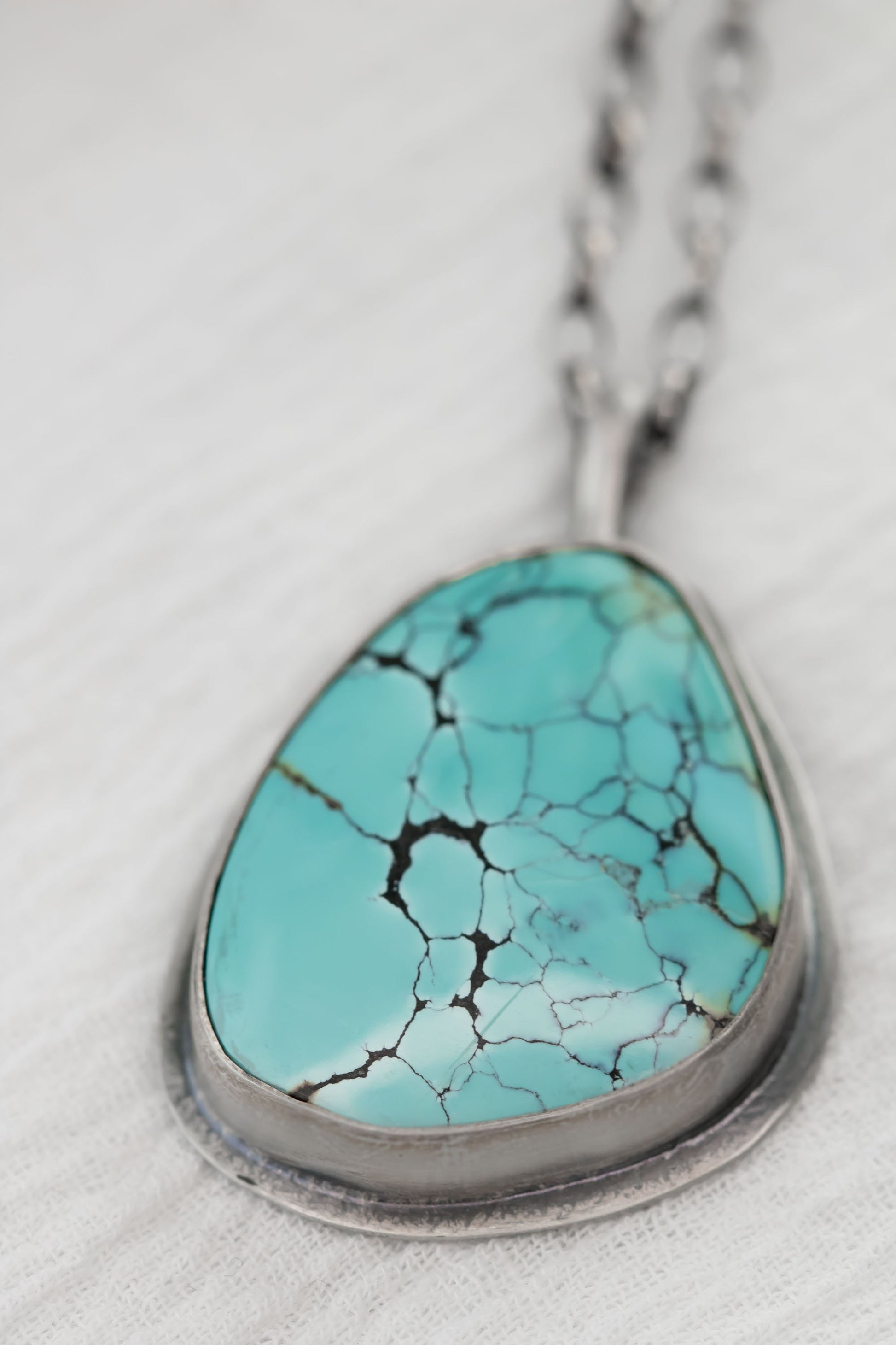 Large Sterling Silver and Genuine Hubei Turquoise with Spiderweb Matrix Necklace on a sterling silver oval chain.