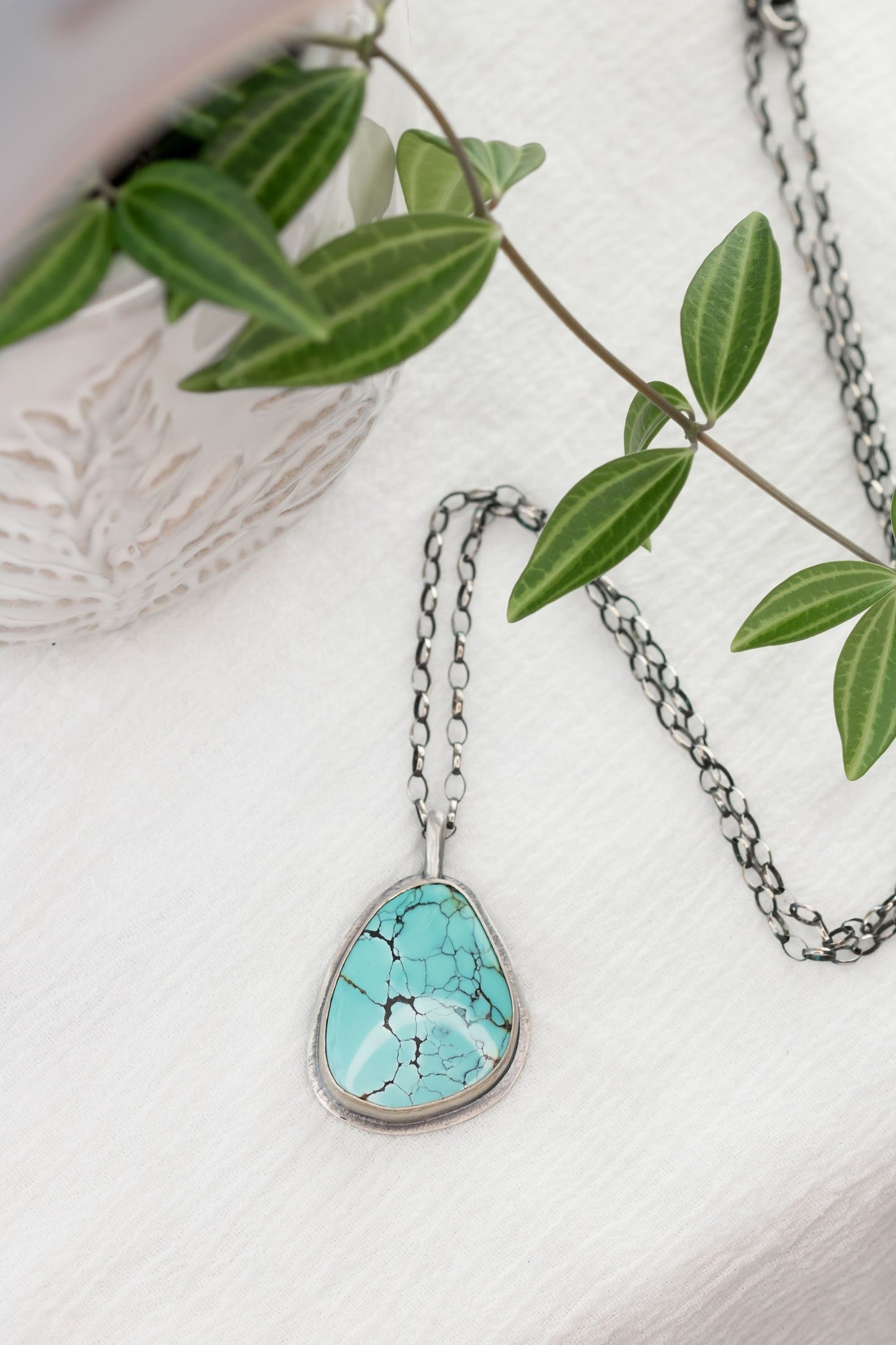 Large Sterling Silver and Genuine Hubei Turquoise with Spiderweb Matrix Necklace on a sterling silver oval chain.