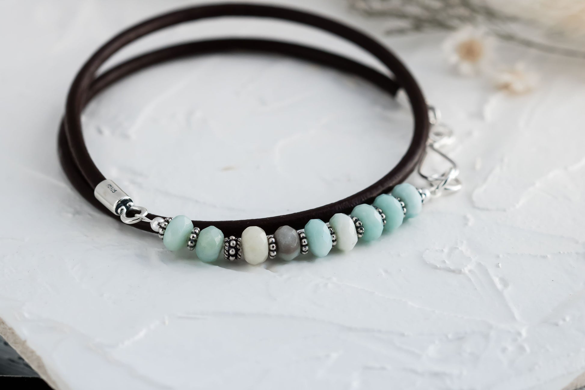 Triple wrap leather cord bracelet made with aqua blue amazonite beads sterling silver accents, and a handcrafted sterling silver hook clasp.