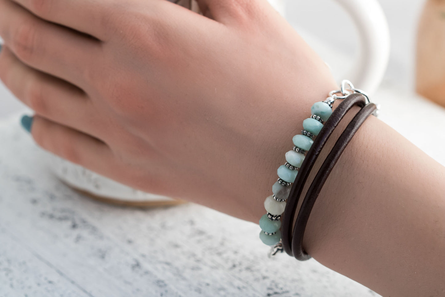 Triple wrap leather cord bracelet made with aqua blue amazonite beads sterling silver accents, and a handcrafted sterling silver hook clasp.