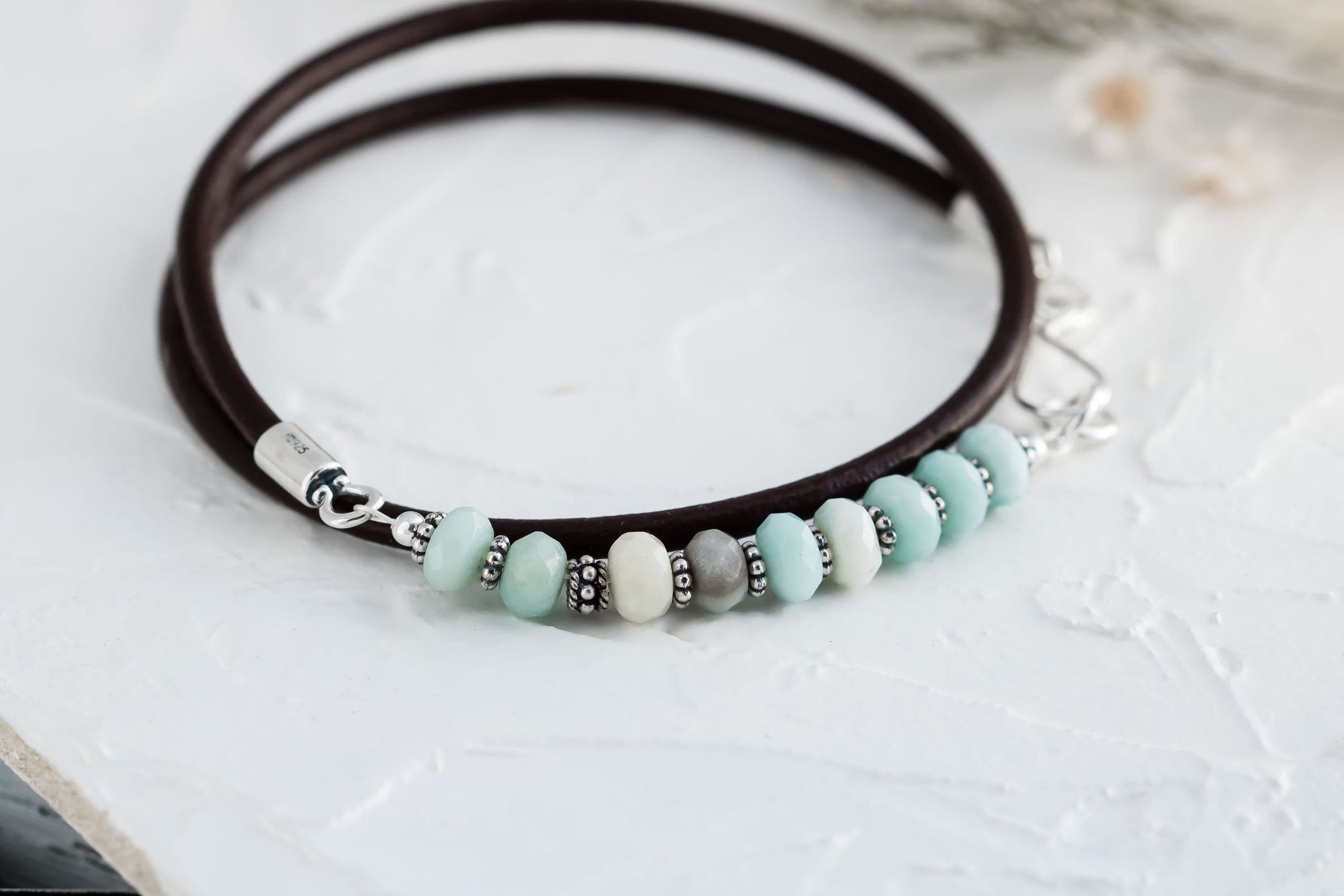 Triple wrap leather cord bracelet made with aqua blue amazonite beads sterling silver accents, and a handcrafted sterling silver hook clasp.